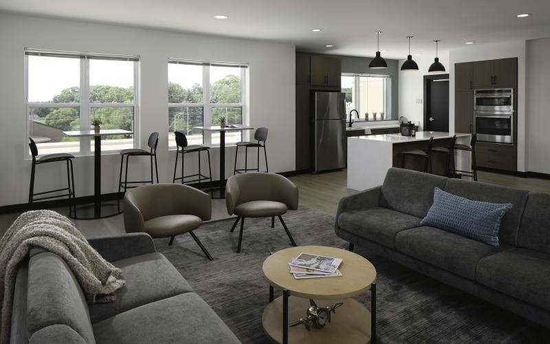 a lounge with a couch and chairs