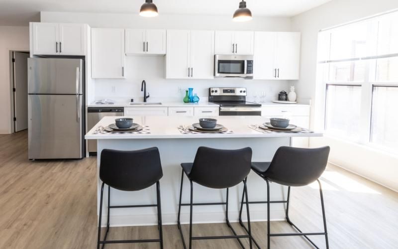 a kitchen with white cabinets