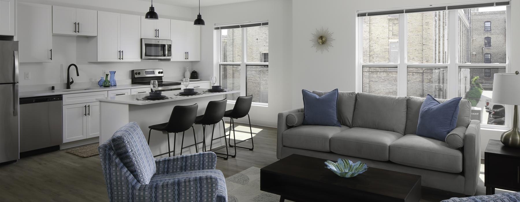 a living room with a couch and chairs